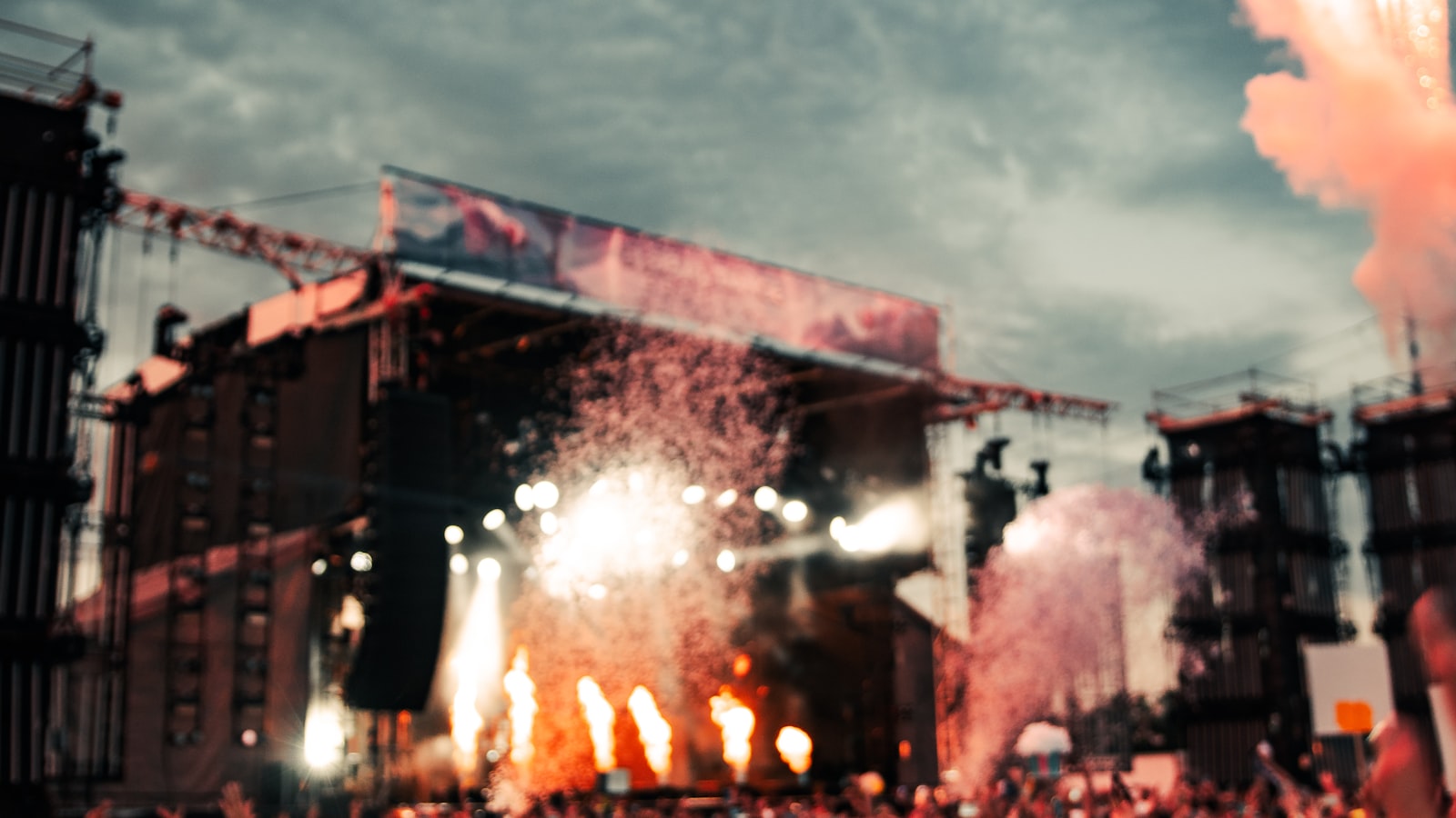 Night festival with the crowd lit by stage lights